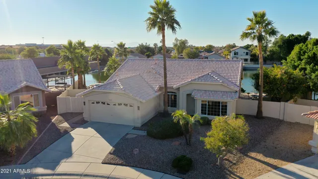 a front view of a house with lake view and a mountain view