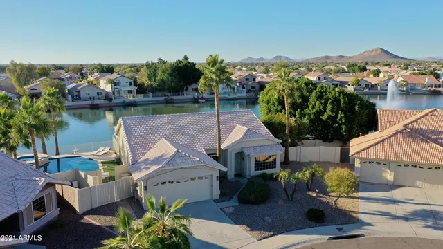 an aerial view of a house with a yard and staircase