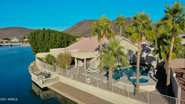 a view of a house with pool yard and outdoor seating