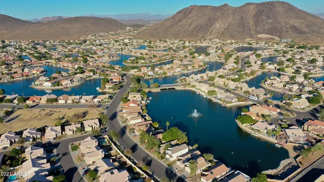 an aerial view of a house with a lake view
