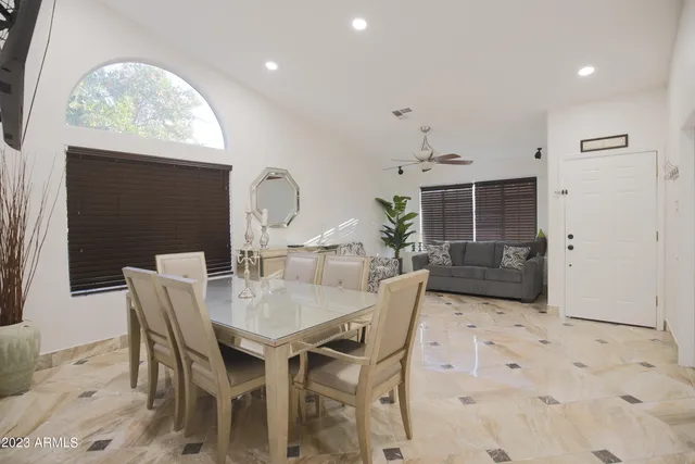 a kitchen with stainless steel appliances kitchen island granite countertop a refrigerator and a stove