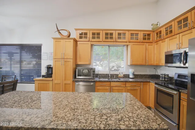 a view of a dining room with furniture and window
