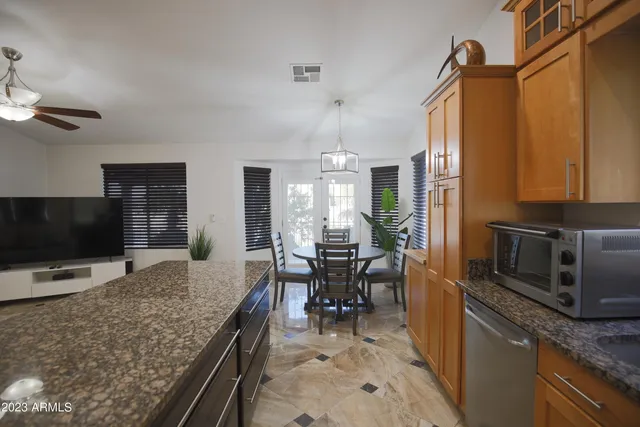 a kitchen with a counter space cabinets and appliances