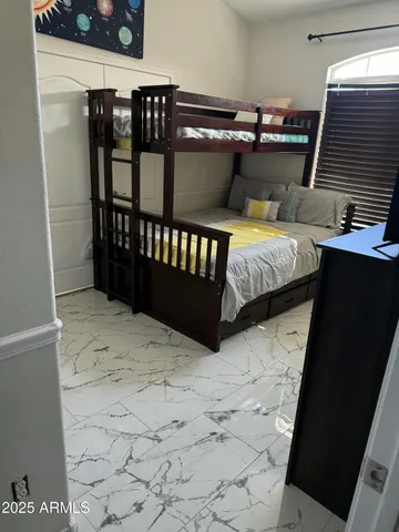 a bathroom with a granite countertop sink mirror and a shower