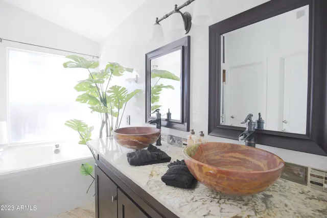 a white toilet sitting in a bathroom next to a white wall