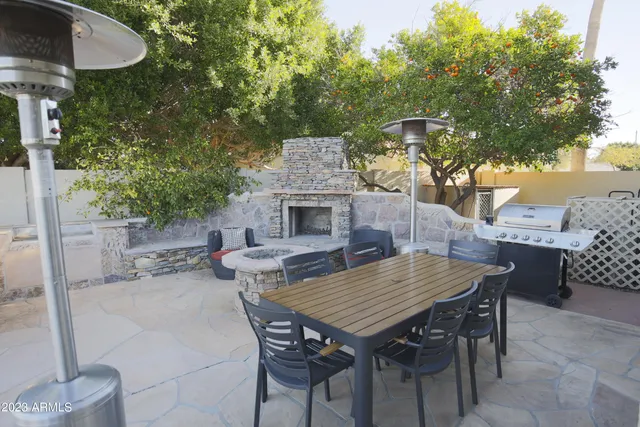 a view of a dinning table and chairs in the patio