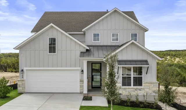 a view of front of house with a yard