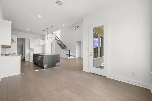 a view of a street with a garden