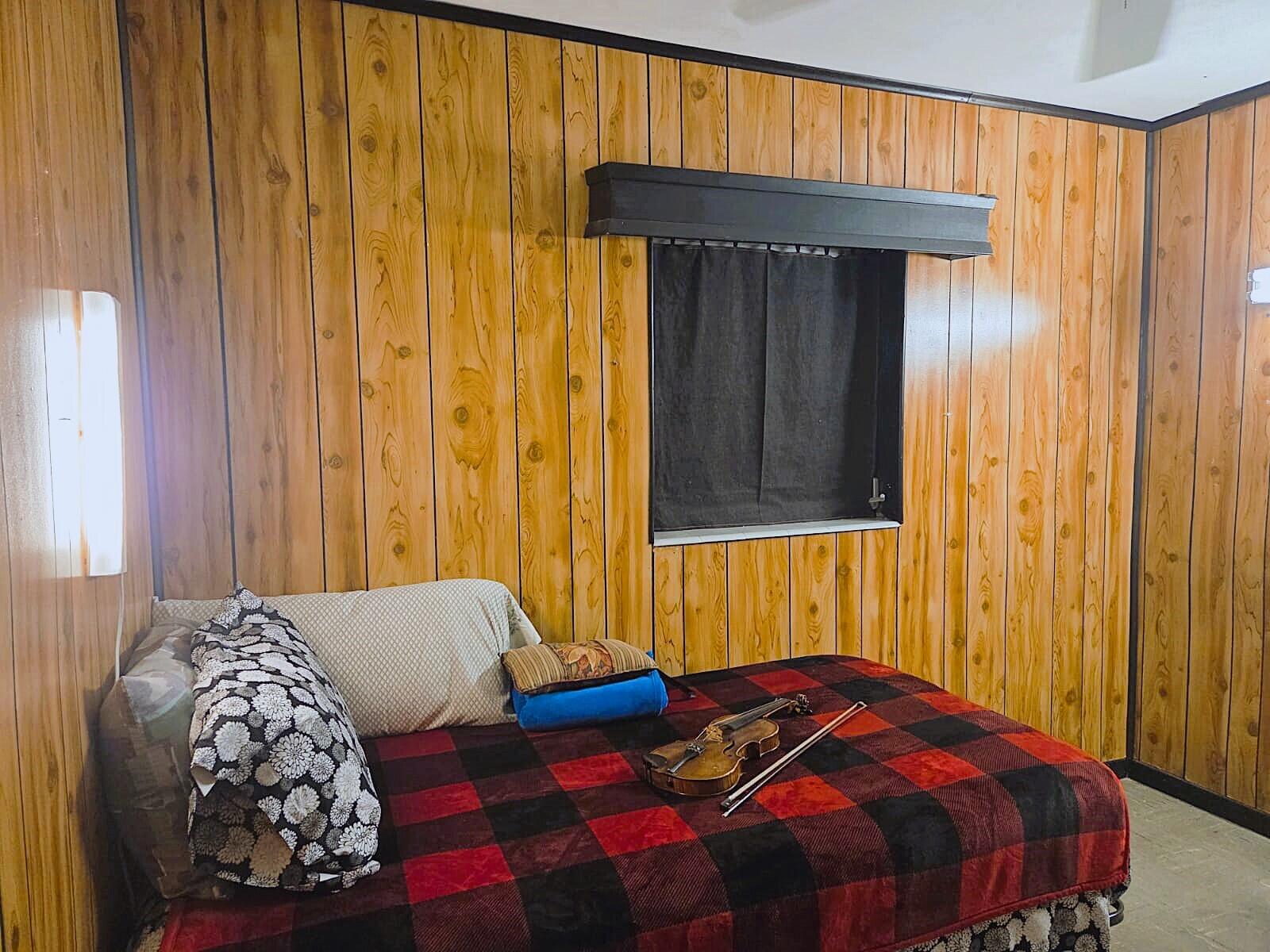 1060 West 26th Court Riviera Beach, FL 33404 - Photo 17 of 23 a bedroom with a bed and a window