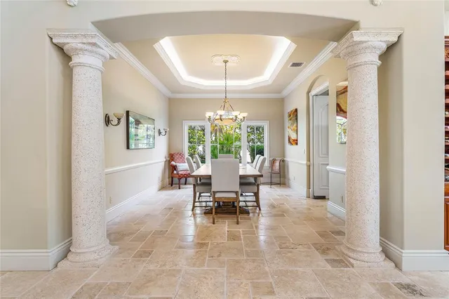 a kitchen with stainless steel appliances granite countertop a sink a counter space and a view of living room