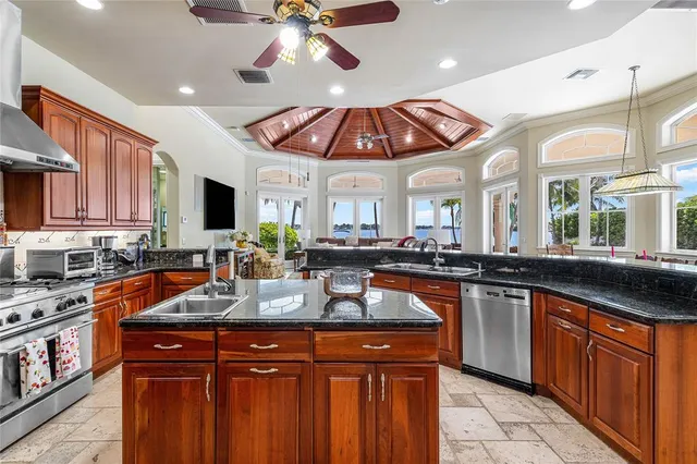 a view of a dining room with furniture and a potted plant