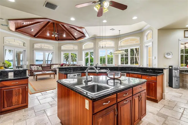 a kitchen with a sink stove and cabinets