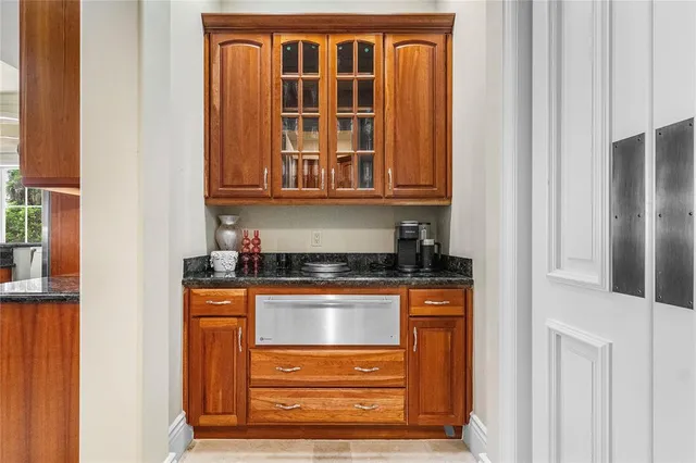 a front view of a house with a yard and a garage