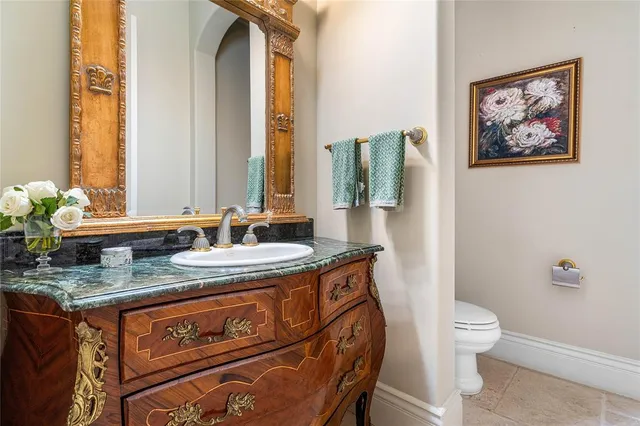 a spacious bathroom with a tub sink and mirror