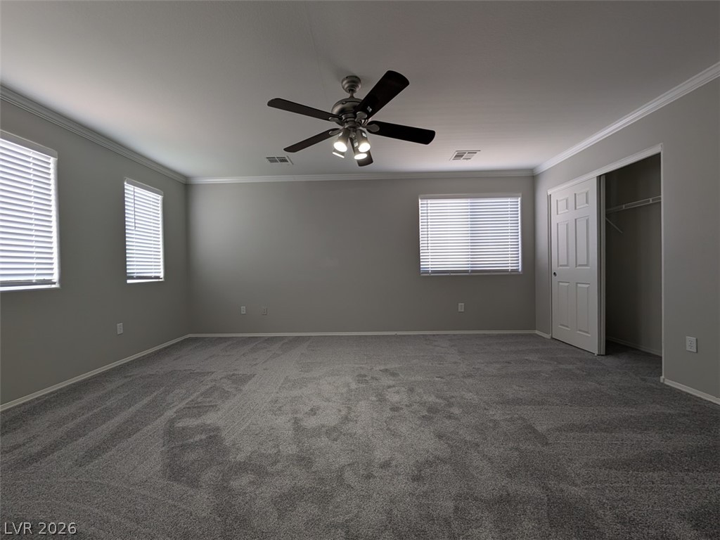 10308 Faustine Avenue Las Vegas, NV 89129 - Photo 21 of 28 An airy bedroom with plush carpet and ample windows awaits your personal touch.