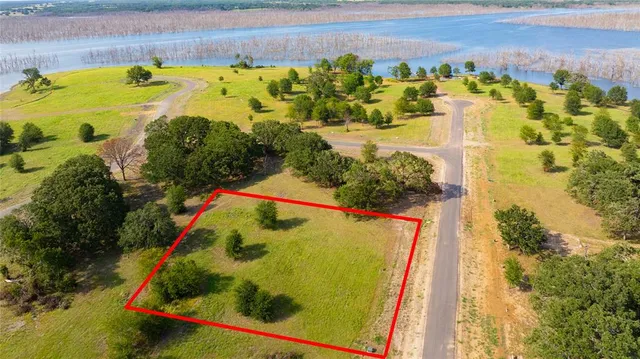 a view of a swimming pool with a yard