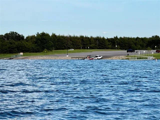 a view of a swimming pool and green space