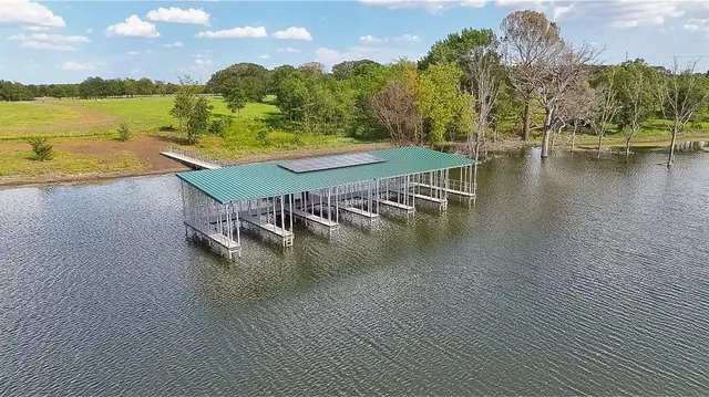 swimming pool view with a lake view