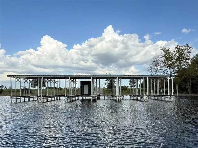 a view of swimming pool with a table and chairs
