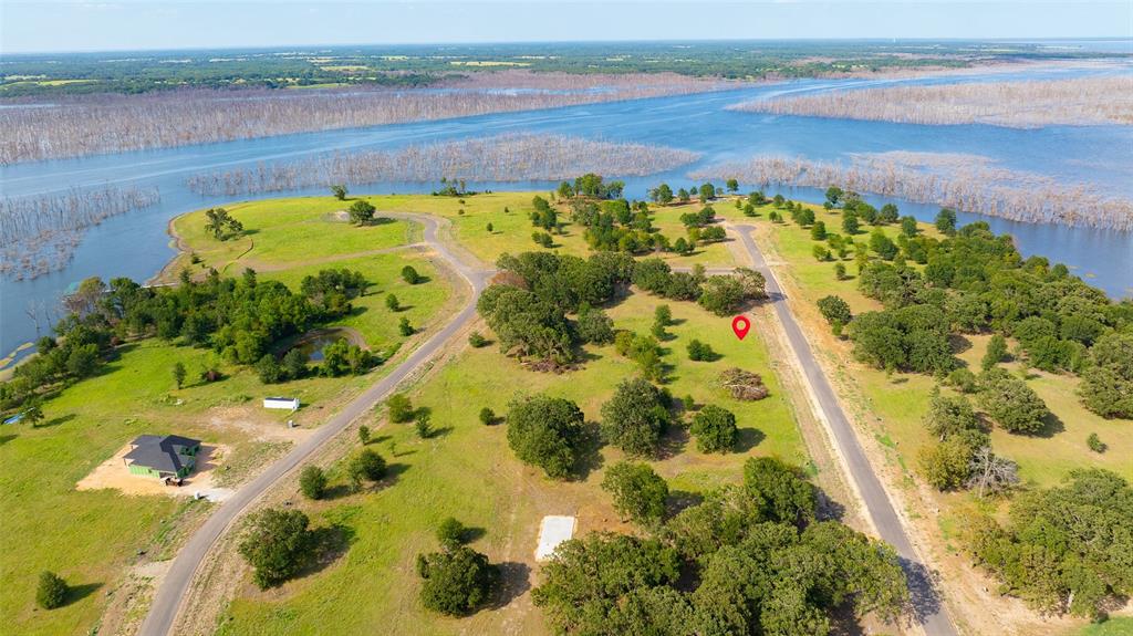 Lot 95 Water Edge Way Bonham, TX 75418 - Photo 8 of 21 a view of a lake with a beach