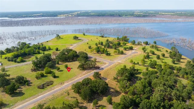 a view of a lake with a building in the background