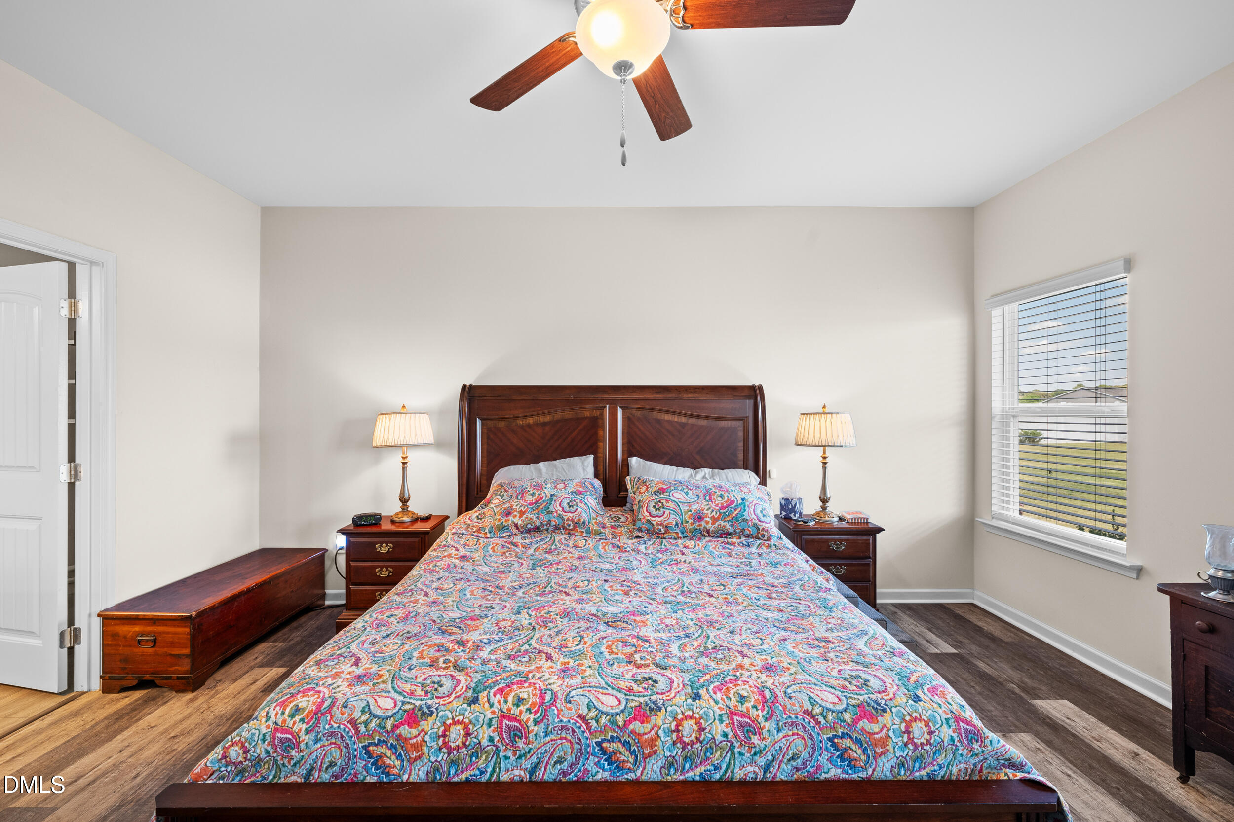91 Charlottes Web Circle Benson, NC 27504 - Photo 13 of 29 a bedroom with a bed and wooden floor