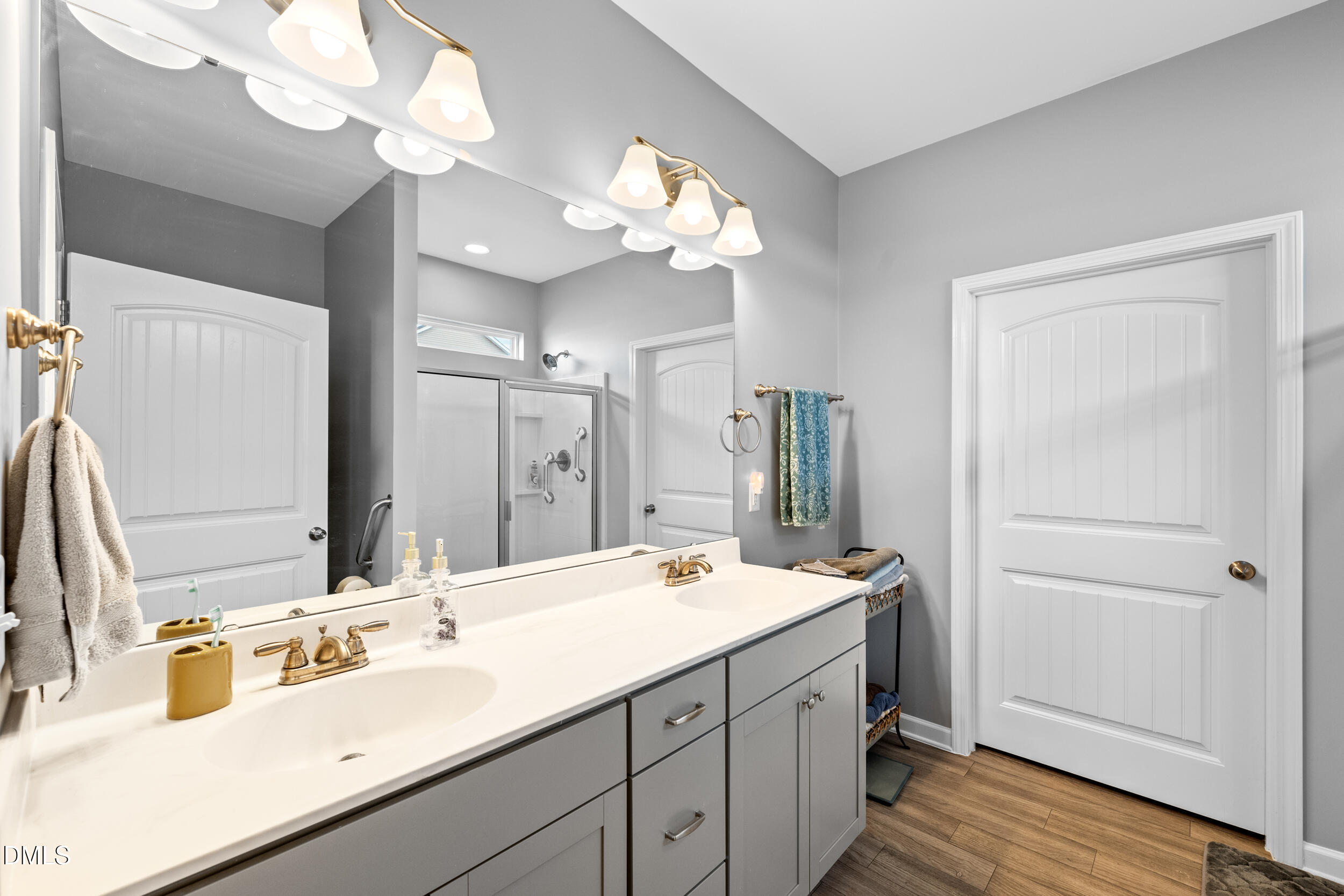 91 Charlottes Web Circle Benson, NC 27504 - Photo 14 of 29 a bathroom with a double vanity sink and a mirror