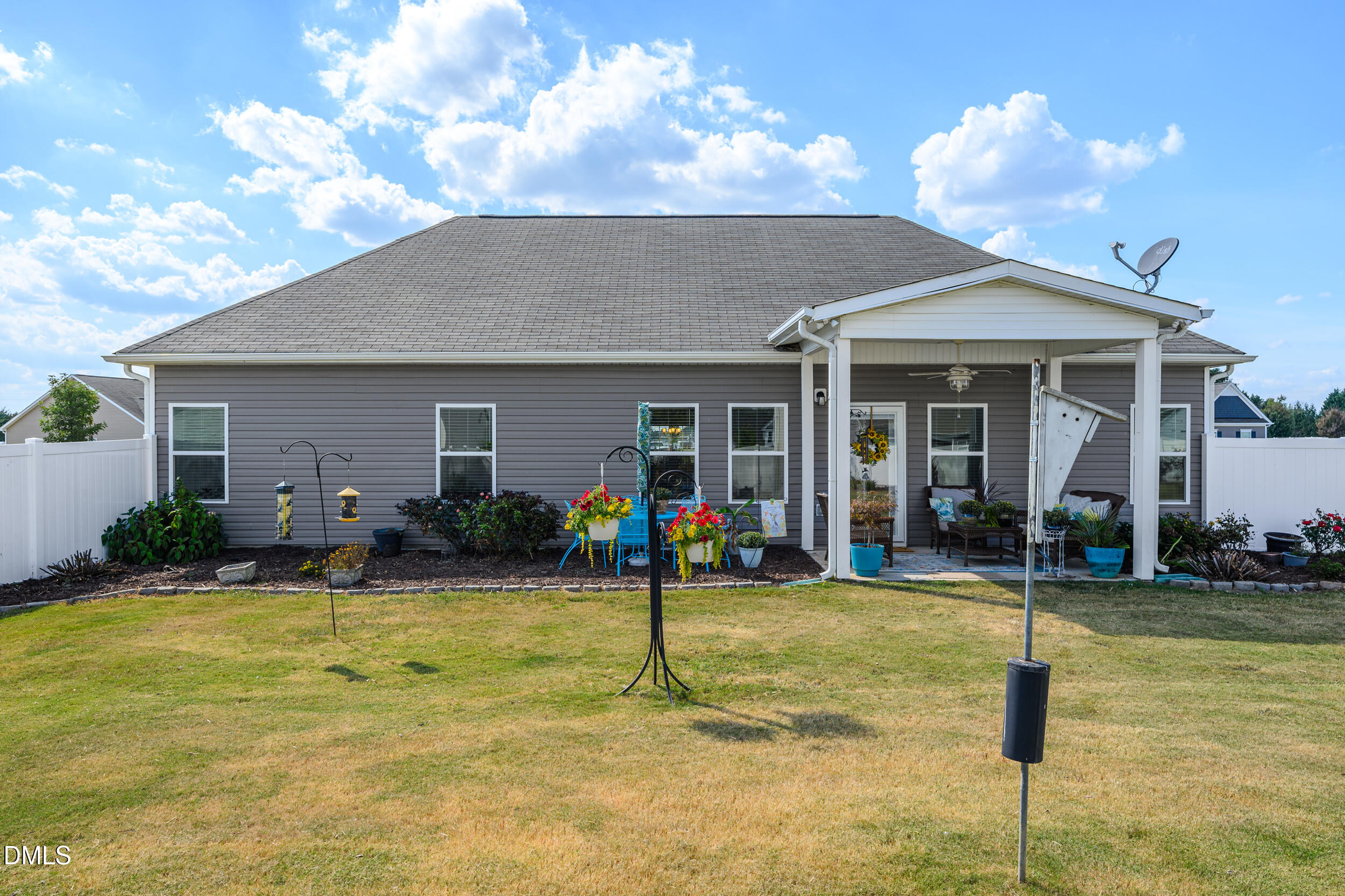 91 Charlottes Web Circle Benson, NC 27504 - Photo 20 of 29 a view of a house with backyard porch and sitting area