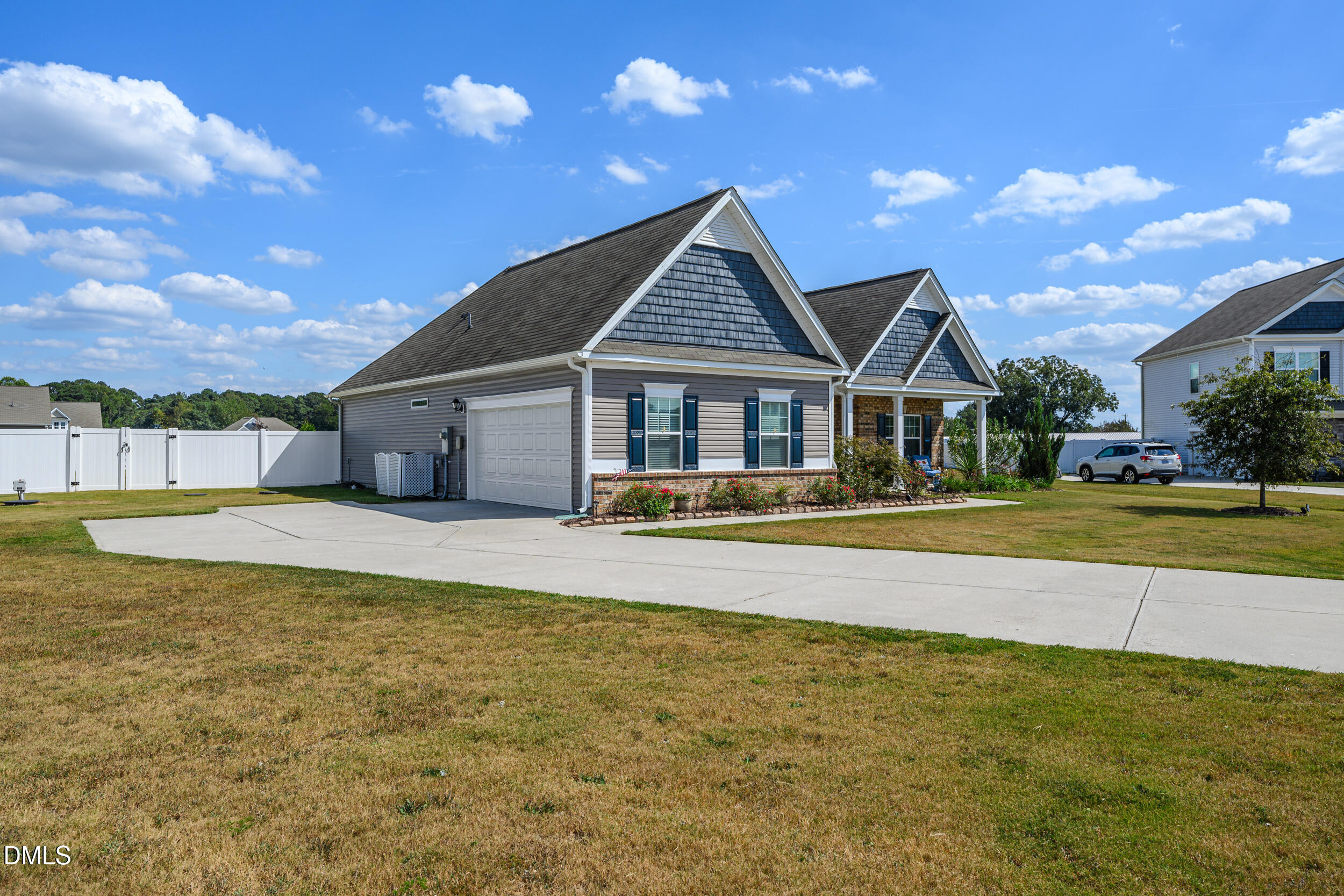 91 Charlottes Web Circle Benson, NC 27504 - Photo 2 of 29 a house with swimming pool in front of it