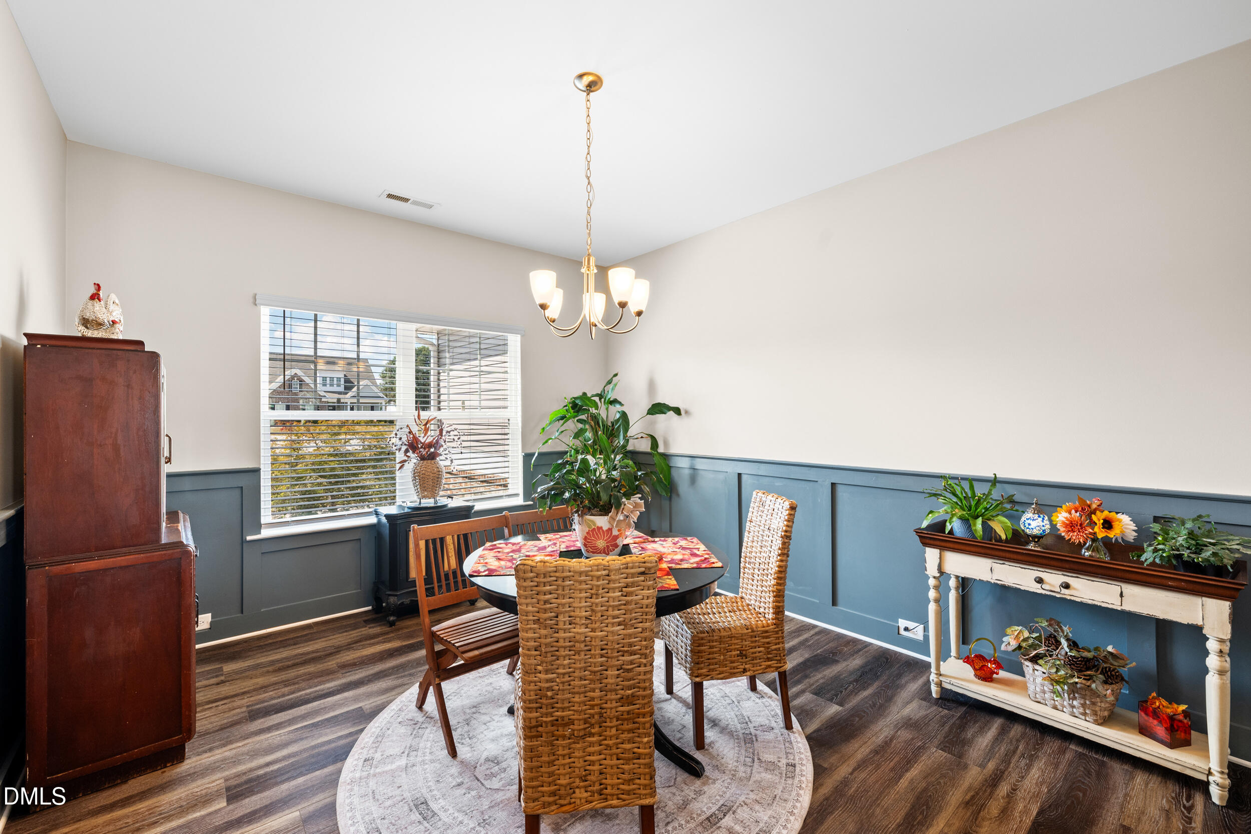 91 Charlottes Web Circle Benson, NC 27504 - Photo 6 of 29 a dining room with furniture a window and a chandelier
