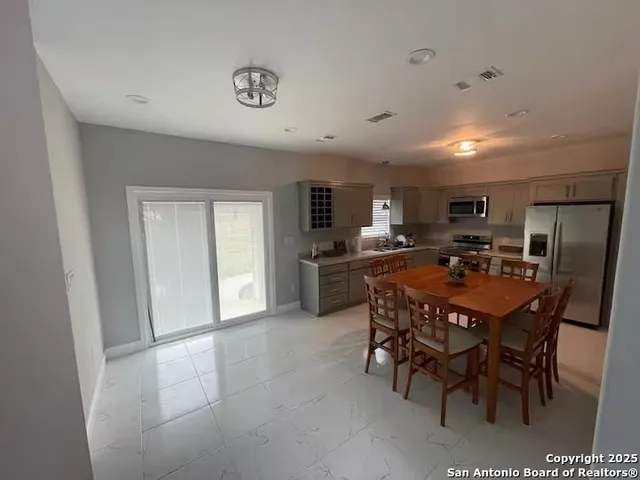 a view of a dining room with furniture