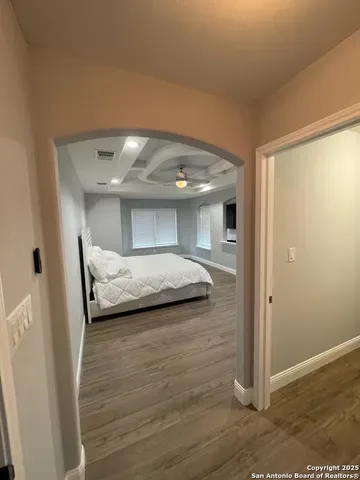 a bedroom with a bed and a mirror