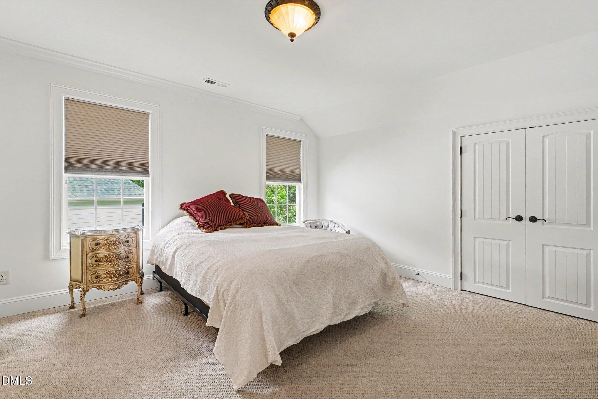 1729 Frenchwood Drive Raleigh, NC 27612 - Photo 23 of 46 a bedroom with a bed and a window