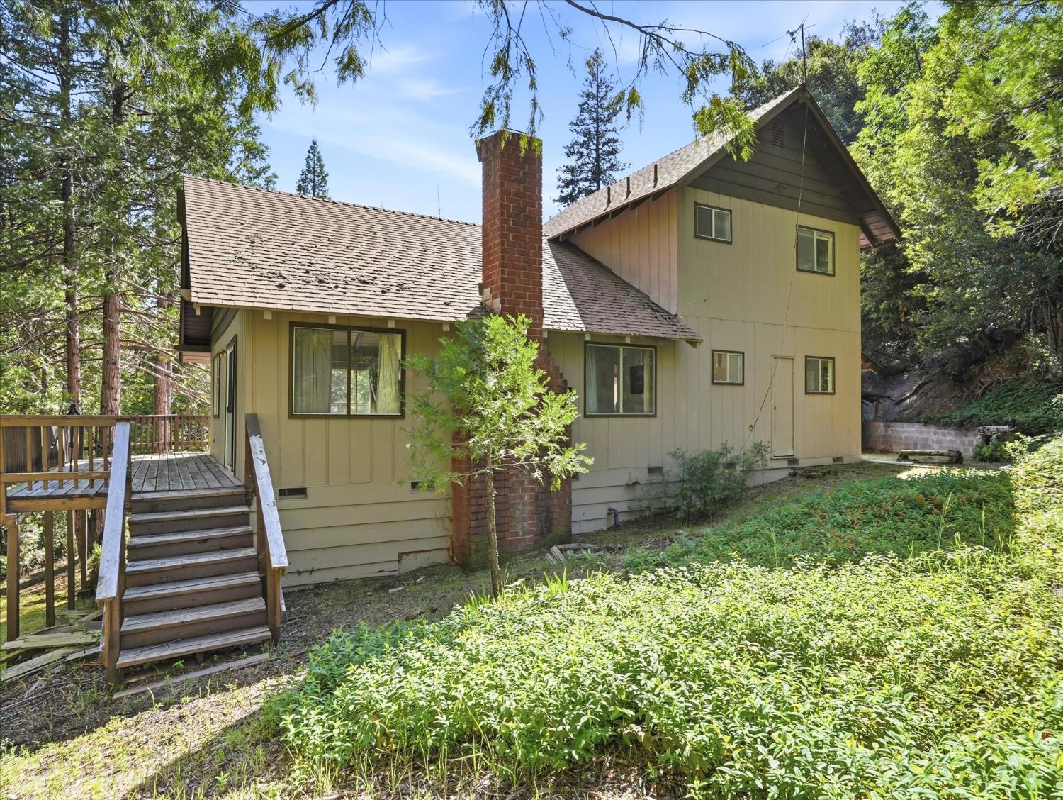 45167 Tolladay Road Oakhurst, CA 93644 - Photo 2 of 50 front view of house with a yard