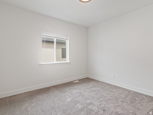 130 East 7085th South, Unit 3 Midvale, UT 84047 - Photo 12 of 30 Spare room with light carpet and baseboards
