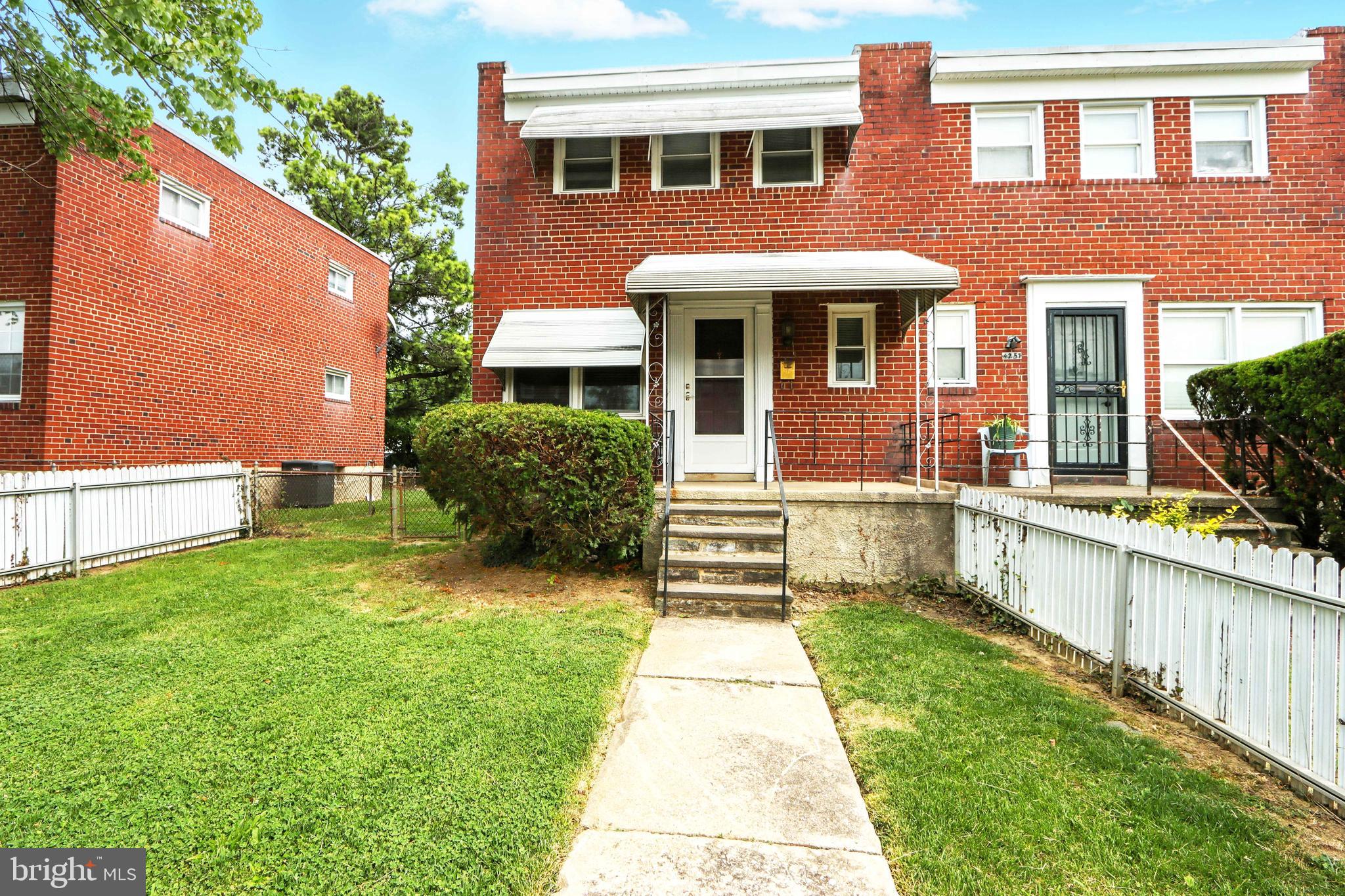 4255 Labyrinth Road Baltimore, MD 21215 - Photo 1 of 27 a front view of a house with garden