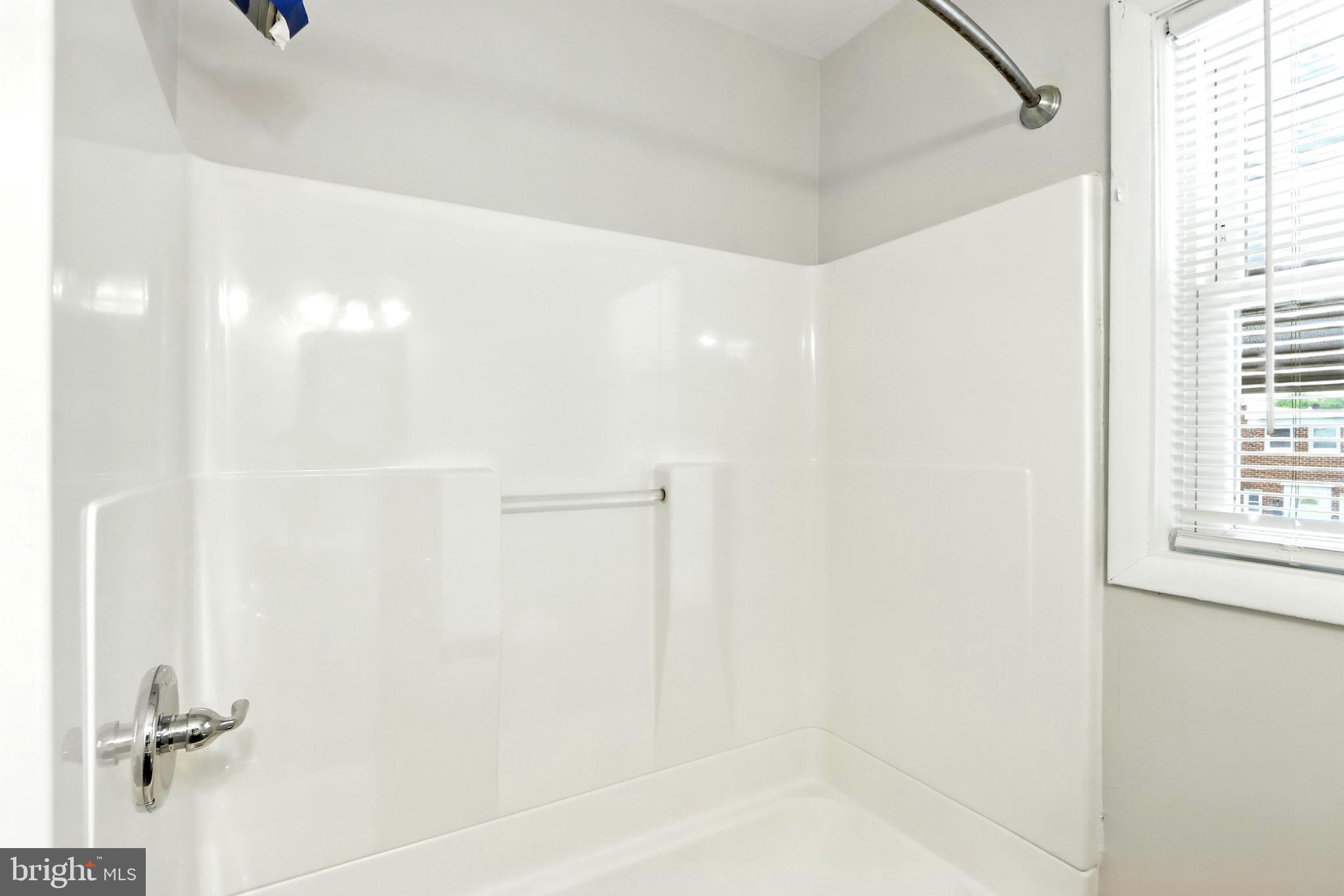 4255 Labyrinth Road Baltimore, MD 21215 - Photo 14 of 27 a bathroom with a shower