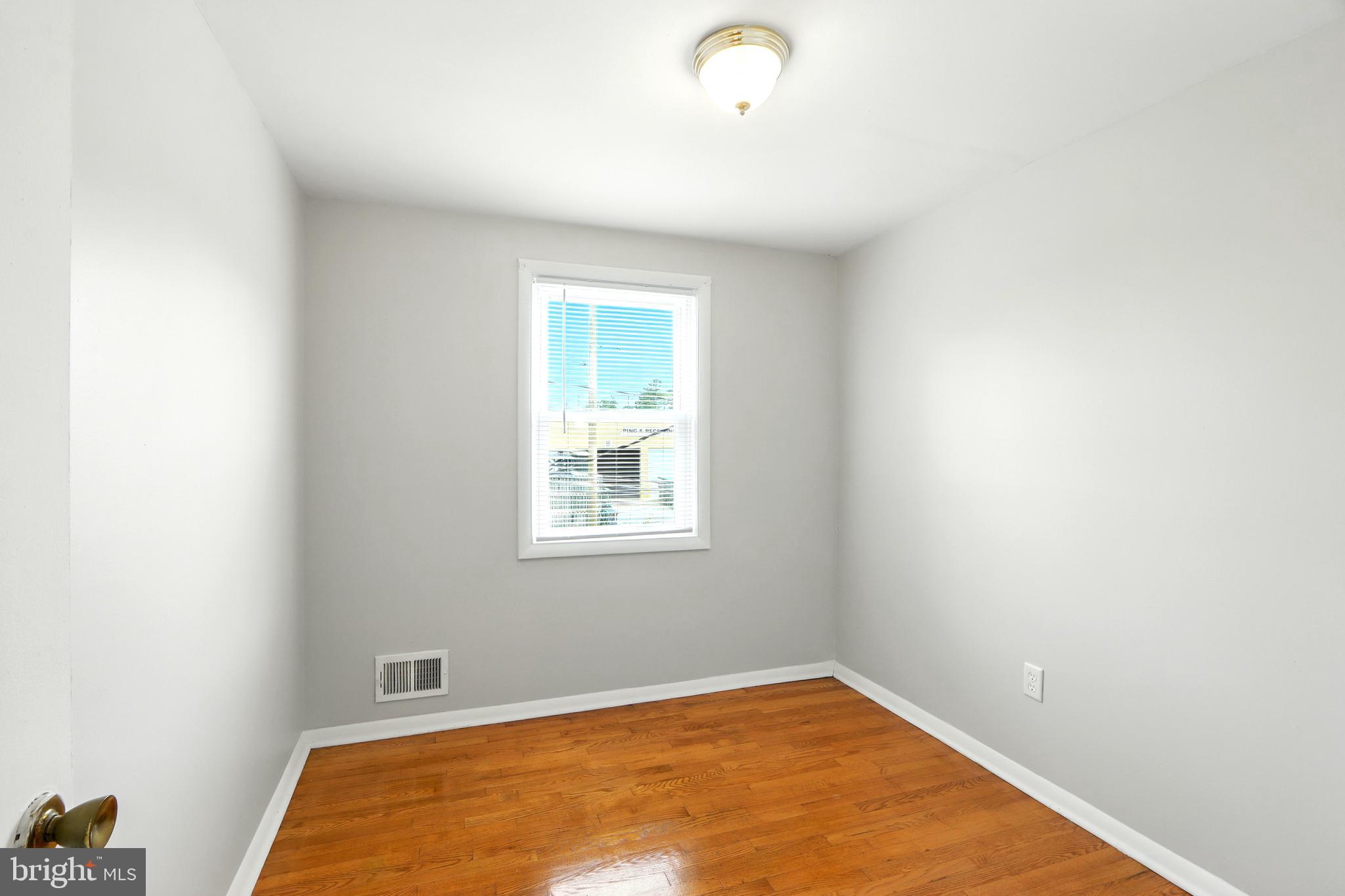 4255 Labyrinth Road Baltimore, MD 21215 - Photo 17 of 27 a view of an empty room with a window