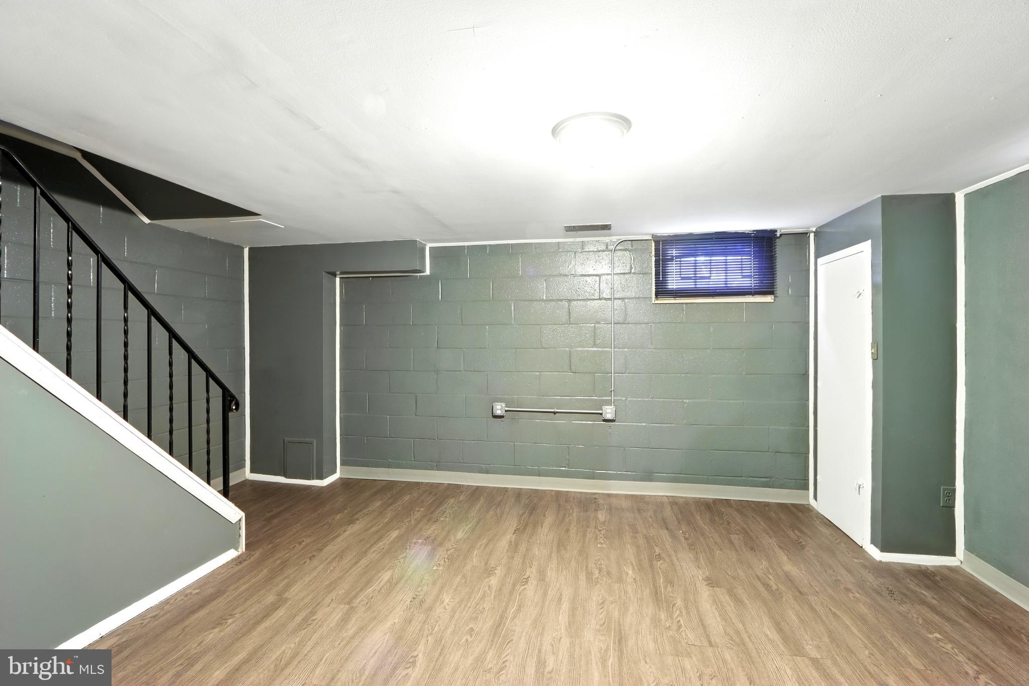 4255 Labyrinth Road Baltimore, MD 21215 - Photo 22 of 27 a view of a hallway with wooden floor