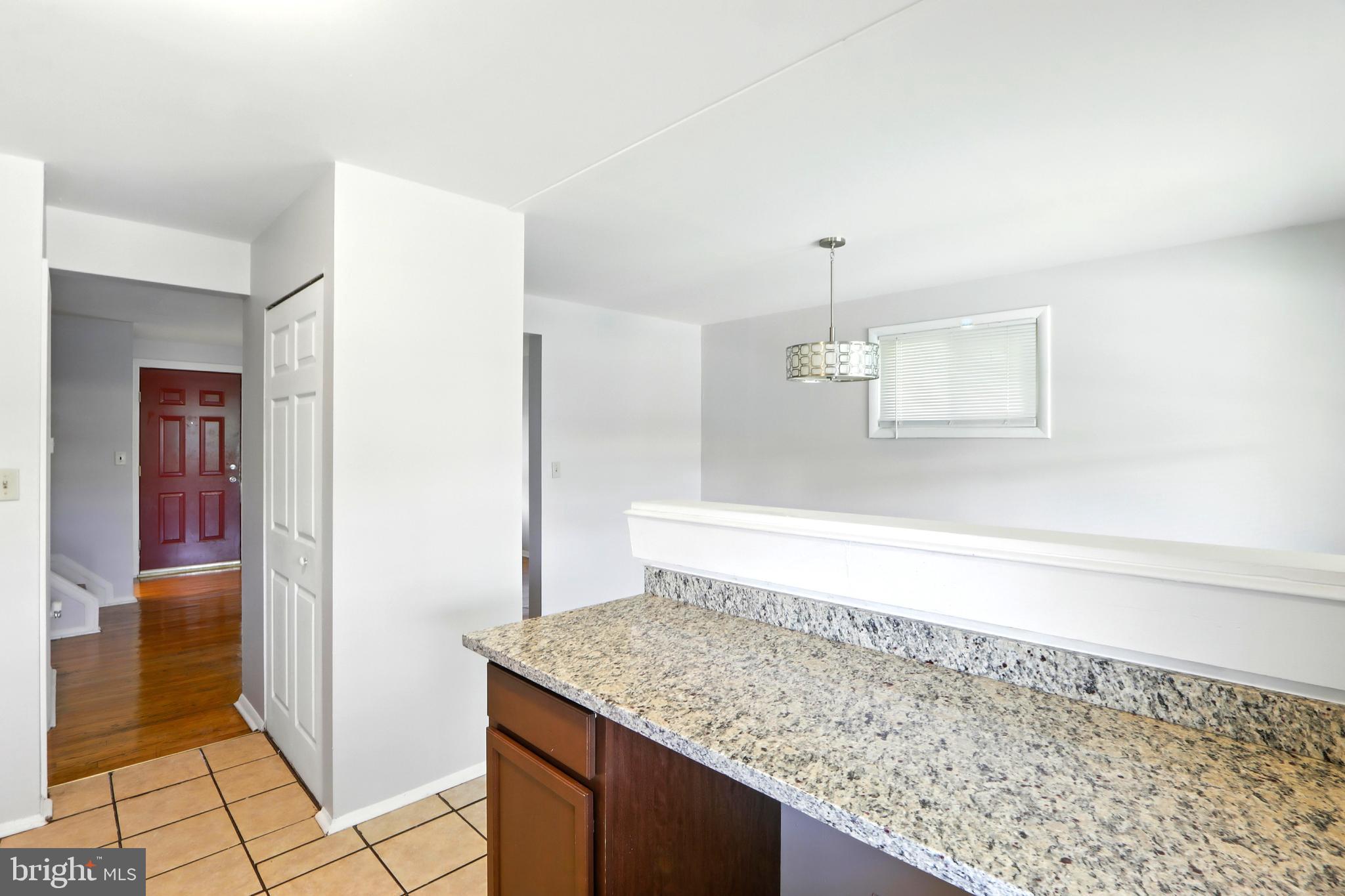 4255 Labyrinth Road Baltimore, MD 21215 - Photo 7 of 27 a bathroom with a granite countertop sink and a mirror