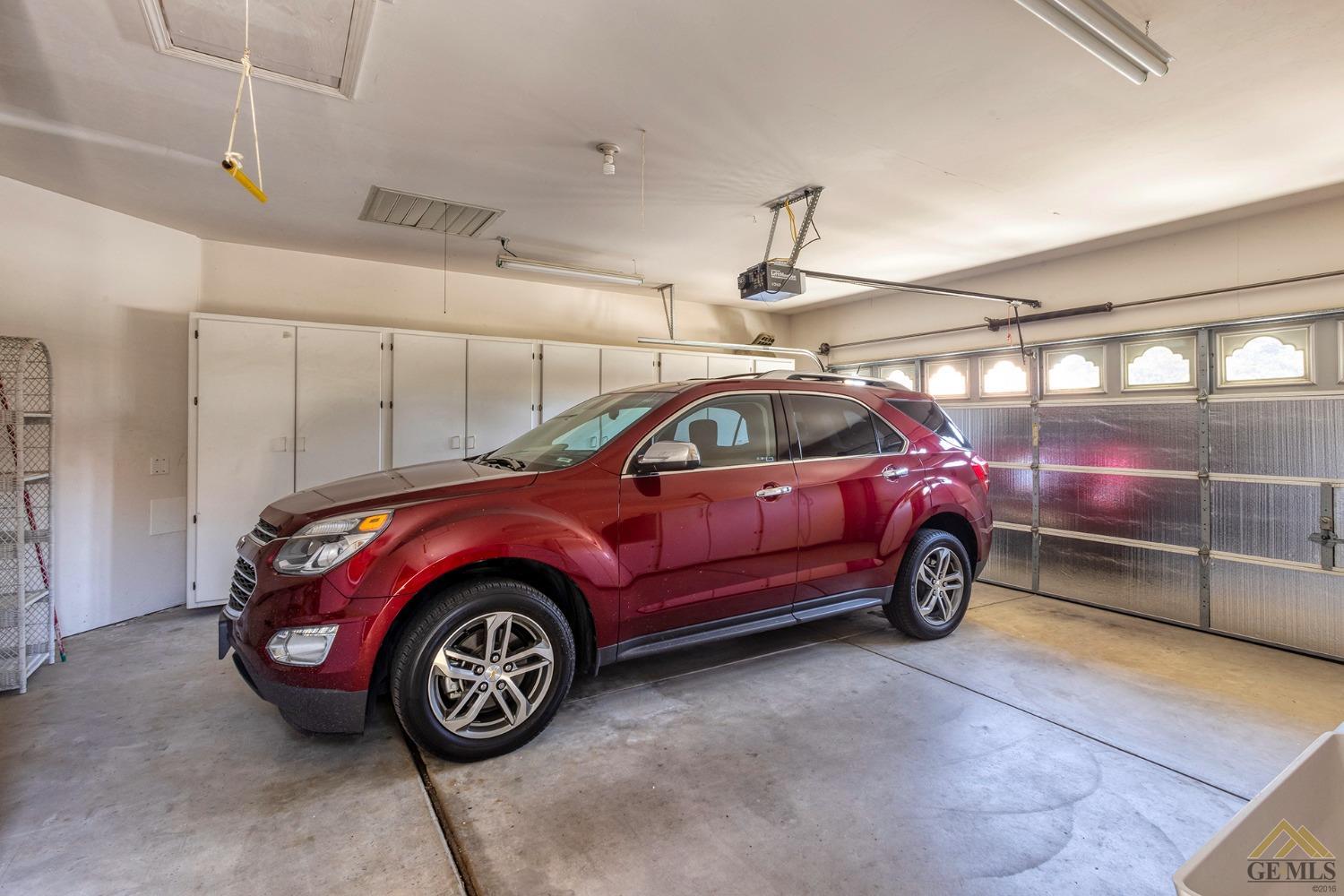 Undisclosed Address Bakersfield, CA 93311 - Photo 11 of 31 a view of a car in garage
