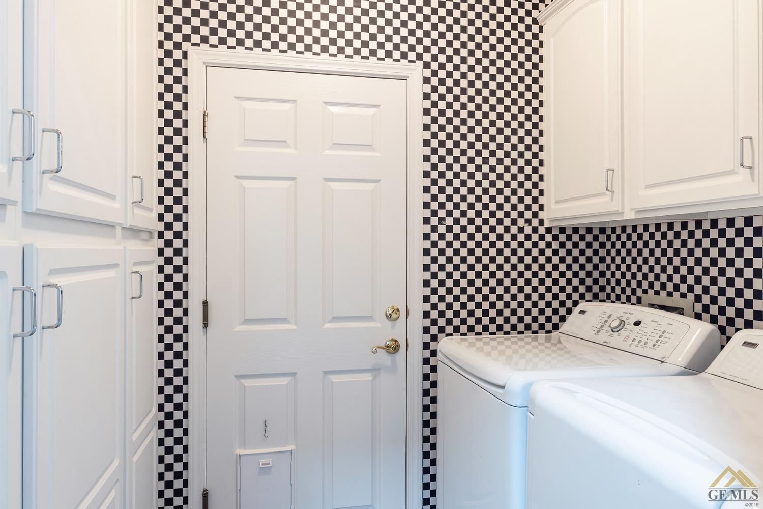 Undisclosed Address Bakersfield, CA 93311 - Photo 13 of 31 a utility room with dryer and white door