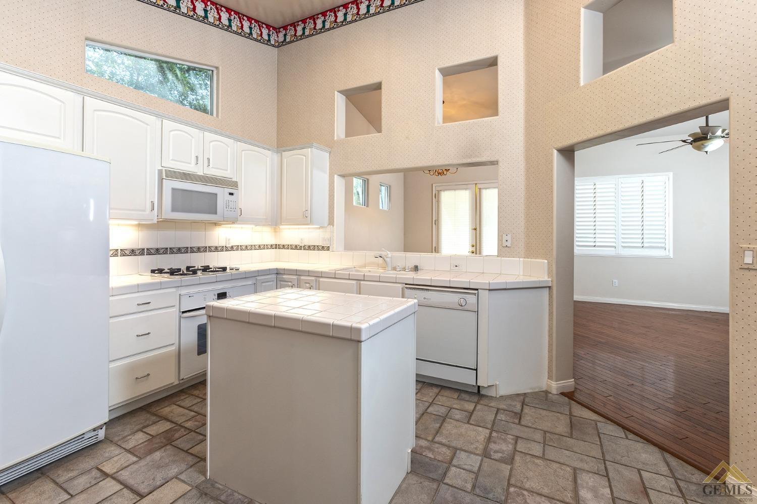 Undisclosed Address Bakersfield, CA 93311 - Photo 15 of 31 a kitchen with a sink cabinets and appliances