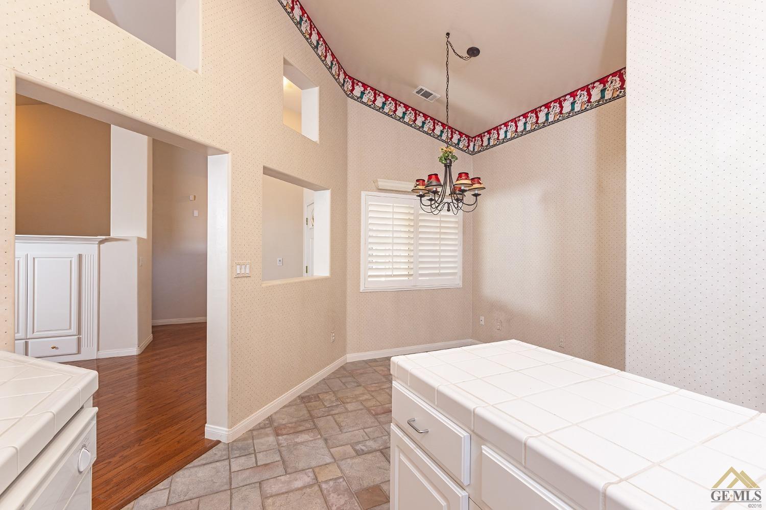 Undisclosed Address Bakersfield, CA 93311 - Photo 17 of 31 a hallway with a wooden floor