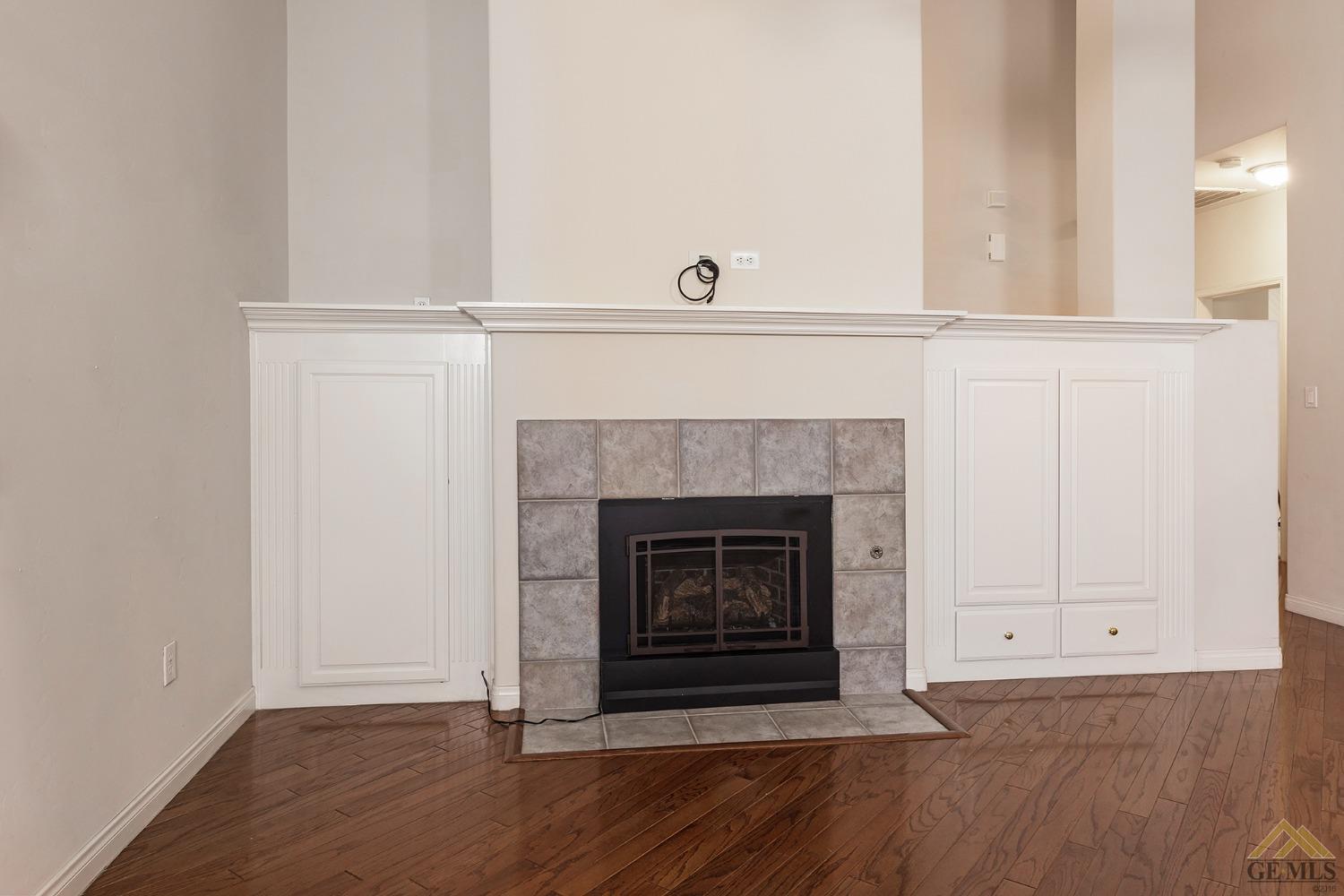 Undisclosed Address Bakersfield, CA 93311 - Photo 20 of 31 a living room with a fireplace