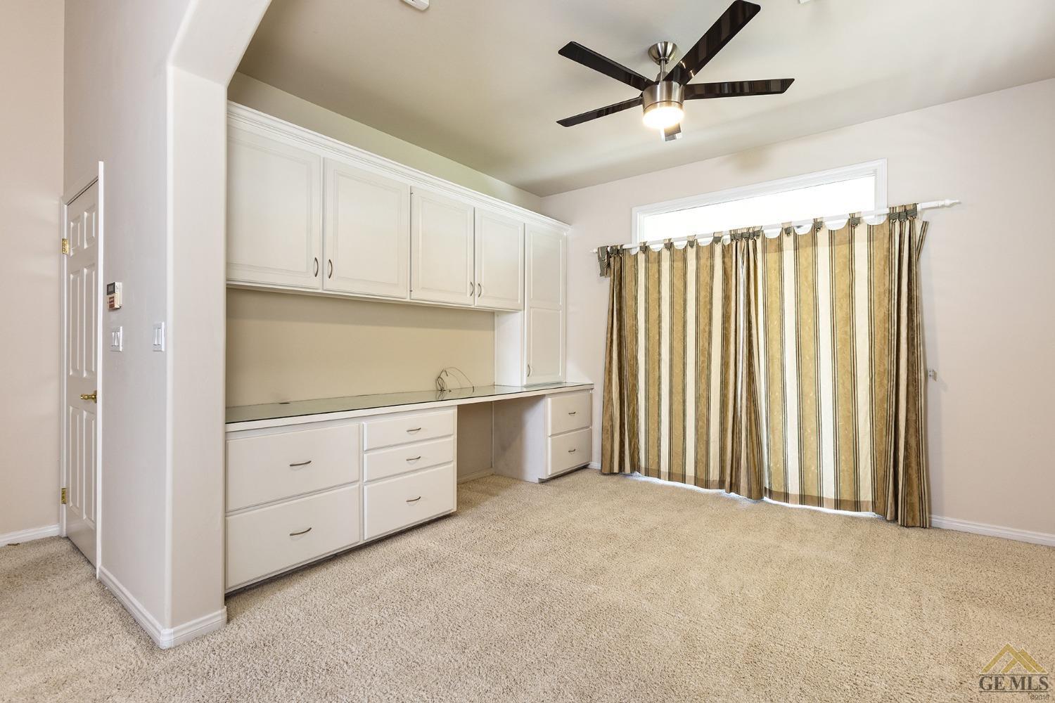 Undisclosed Address Bakersfield, CA 93311 - Photo 26 of 31 a kitchen with white cabinets and white appliances
