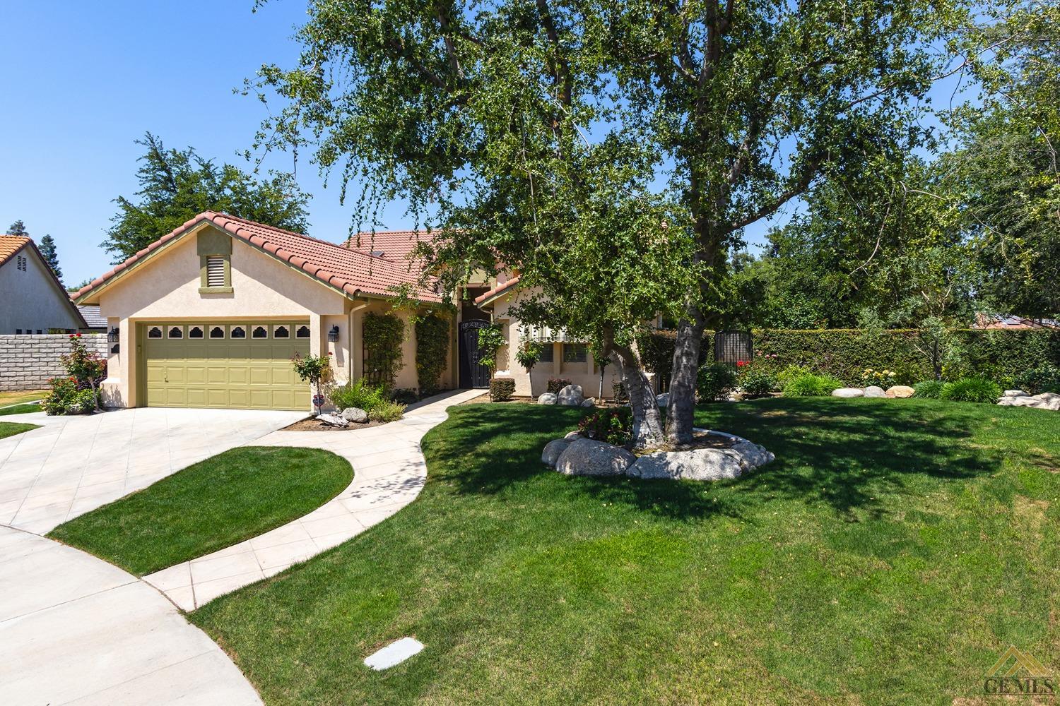 Undisclosed Address Bakersfield, CA 93311 - Photo 31 of 31 a front view of a house with a yard and garage