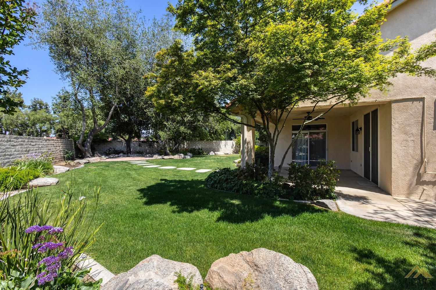 Undisclosed Address Bakersfield, CA 93311 - Photo 5 of 31 a view of backyard with garden and outdoor seating