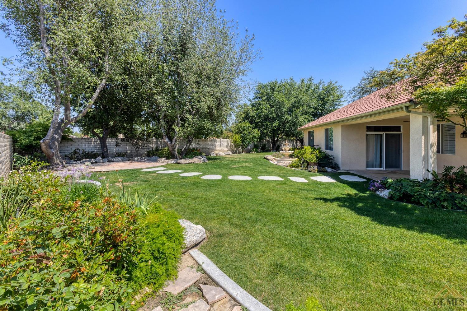 Undisclosed Address Bakersfield, CA 93311 - Photo 6 of 31 a backyard of a house with lots of green space