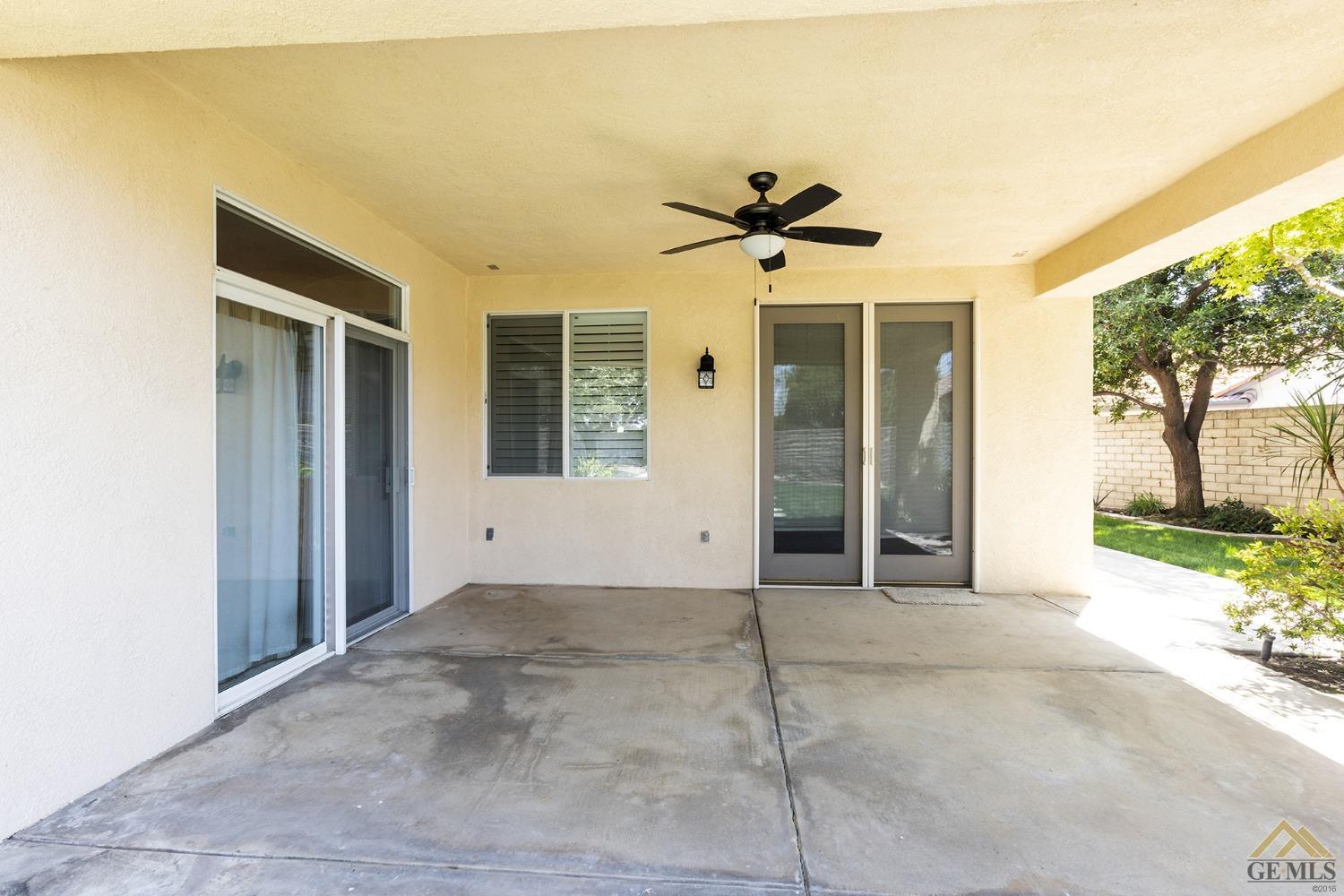 Undisclosed Address Bakersfield, CA 93311 - Photo 9 of 31 a view of a big room with windows and chandelier fan
